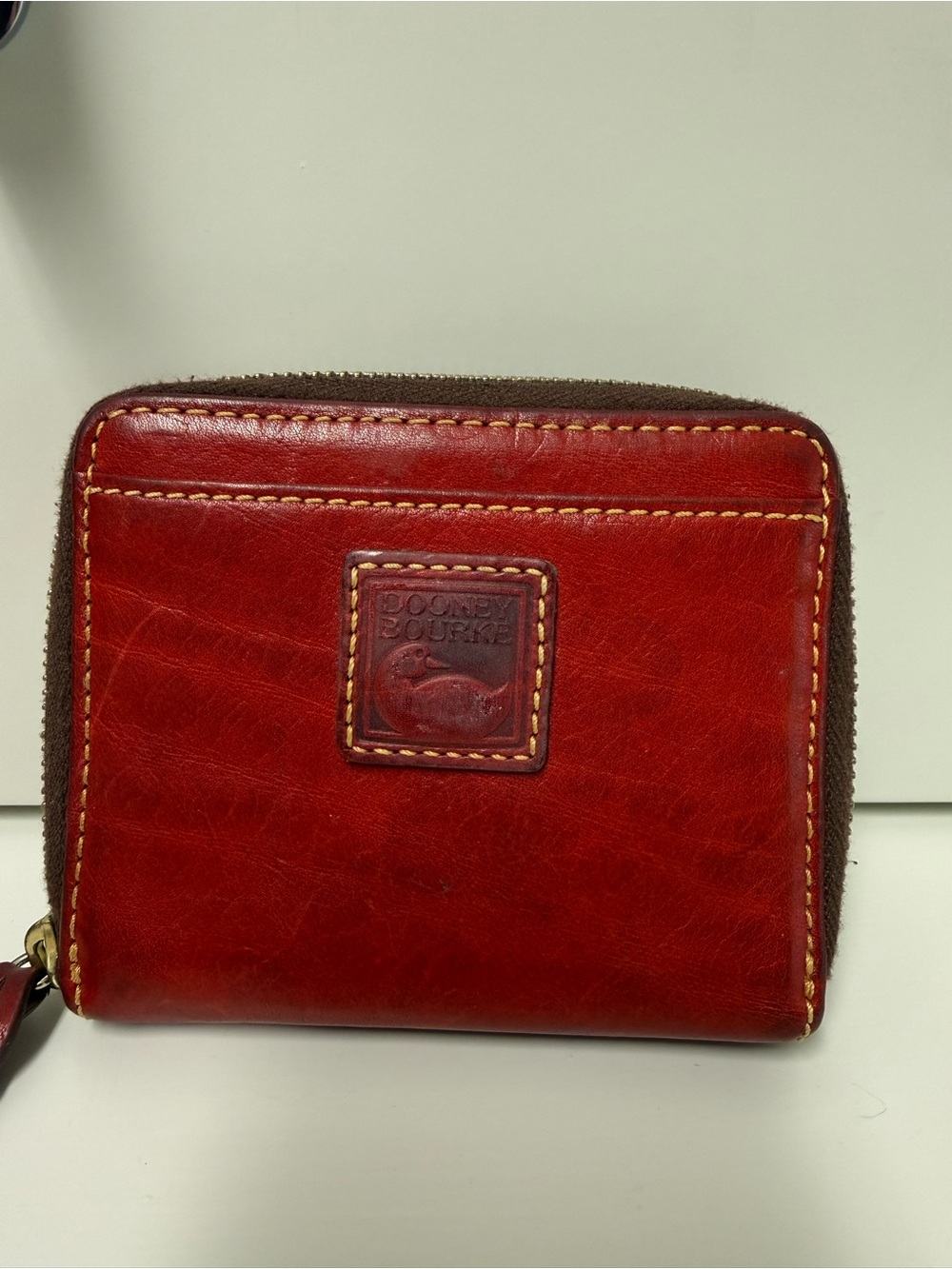 Dooney & Bourke Red Leather Zip Wallet with Contrast Stitching